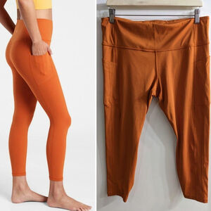 Athleta | Ultimate Stash 7/8 pocket leggings in Rust Orange